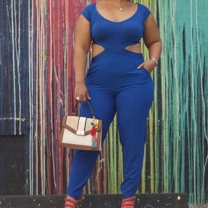 Bebe Blue Jumpsuit with waist cut outs